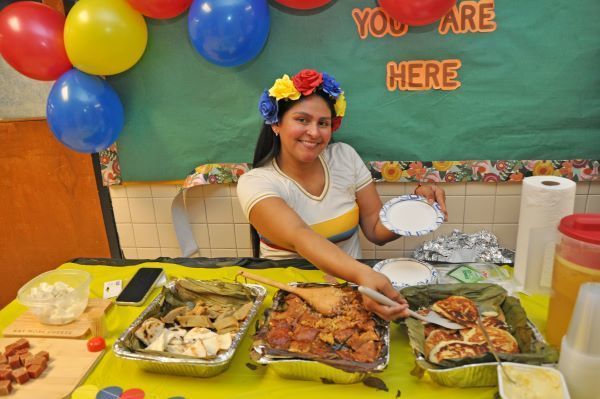 A woman in a floral crown serving food