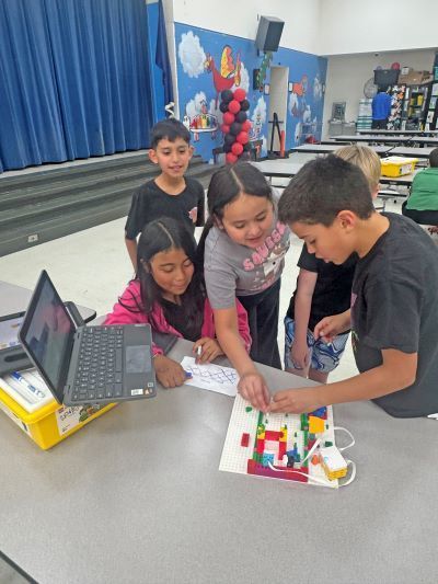 Students gathered around a game