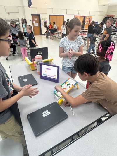 Students looking at a lego-based game