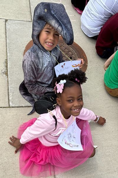 Students dressed as a dinosaur and barbie