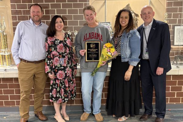 Amy Zambron holding receiving award