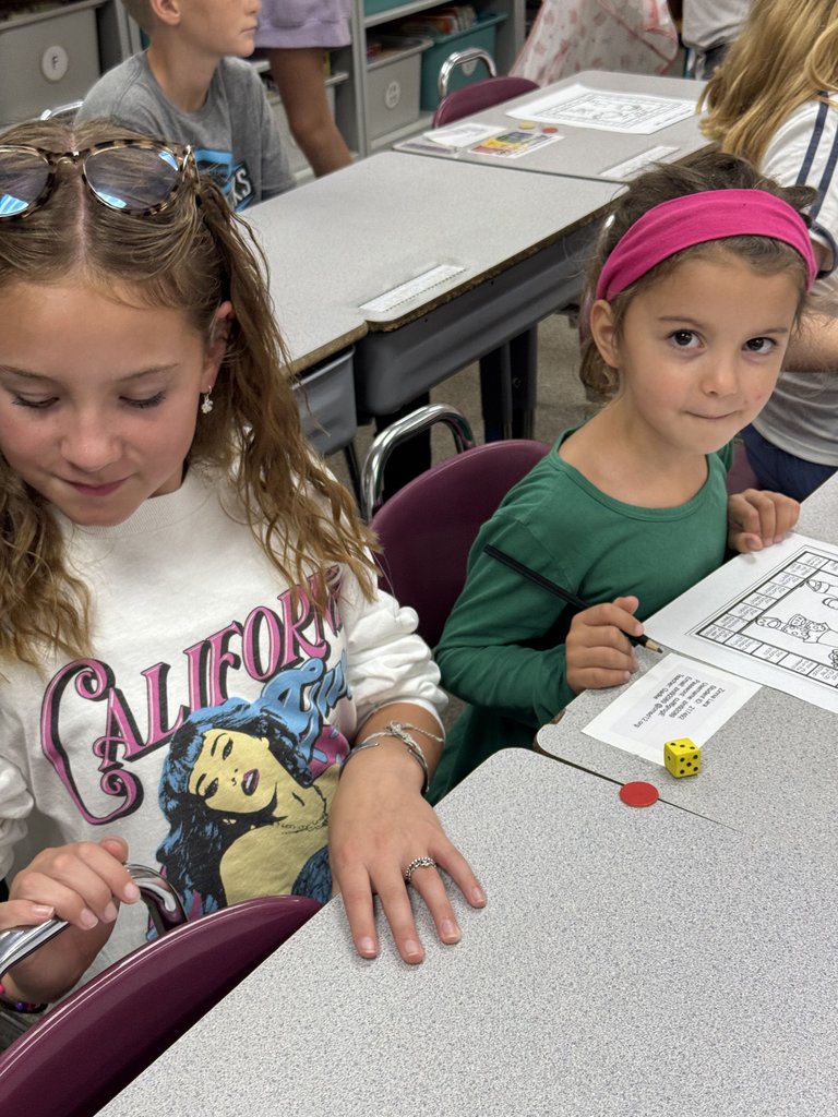 6th Graders with their First Grade Buddies here at GCE!