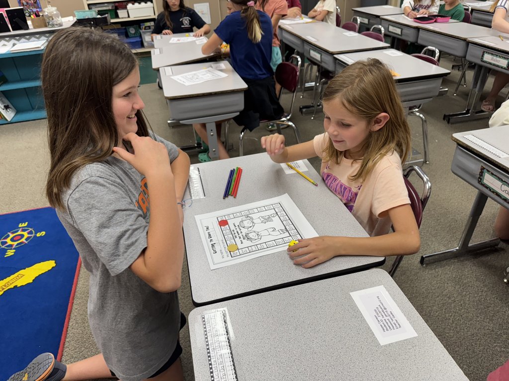 6th Graders with their First Grade Buddies here at GCE!