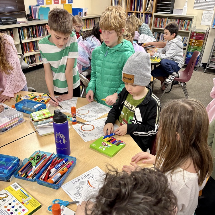 5th graders with their 1st grade buddies working on a special solar system project as part of Space Week at CME☀️🌖🌎🪐