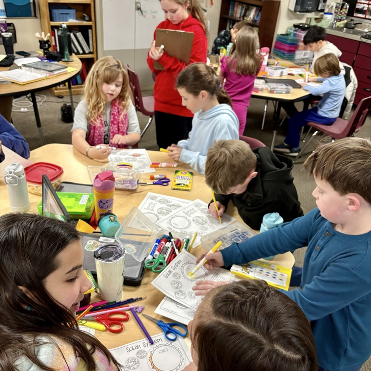 5th graders with their 1st grade buddies working on a special solar system project as part of Space Week at CME☀️🌖🌎🪐