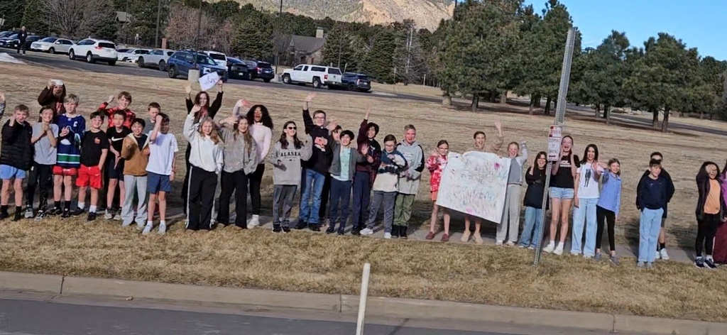 Gold Camp Elementary students and staff packed the sidewalk outside, cheering loud and proud as they sent the CMHS girls swimming and diving state team off to state—Go Hawks!
