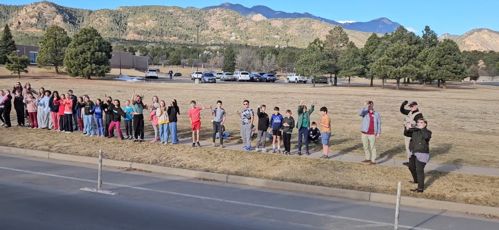 Gold Camp Elementary students and staff packed the sidewalk outside, cheering loud and proud as they sent the CMHS girls swimming and diving state team off to state—Go Hawks!