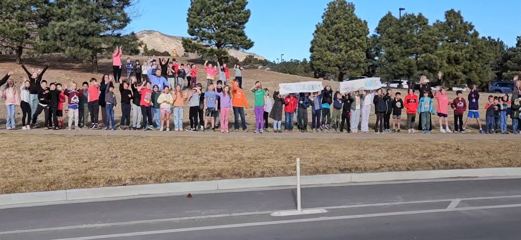 Gold Camp Elementary students and staff packed the sidewalk outside, cheering loud and proud as they sent the CMHS girls swimming and diving state team off to state—Go Hawks!