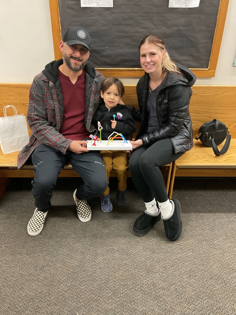 A family showing their art project