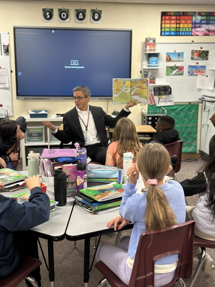  Dr Peak reading to students