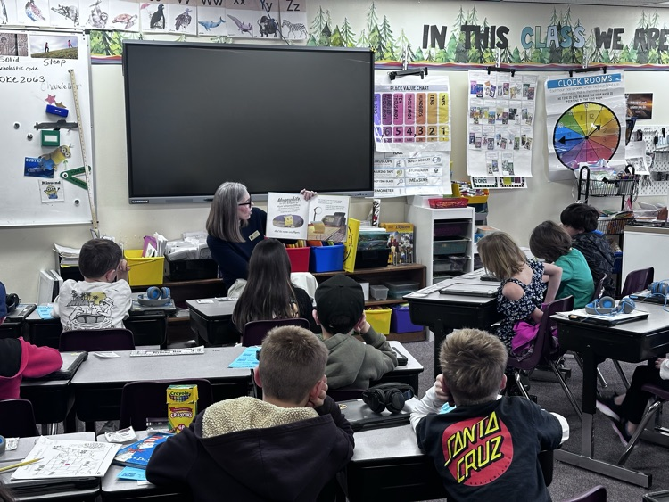 BOE member Mehall reading to 2nd graders