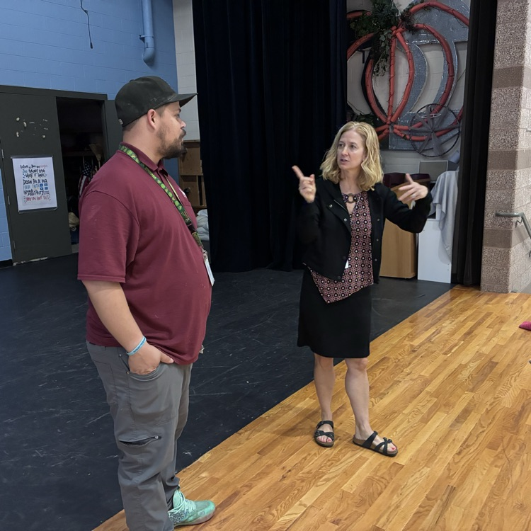 Mrs. Johnson and Mr. Olan planning the final touches.