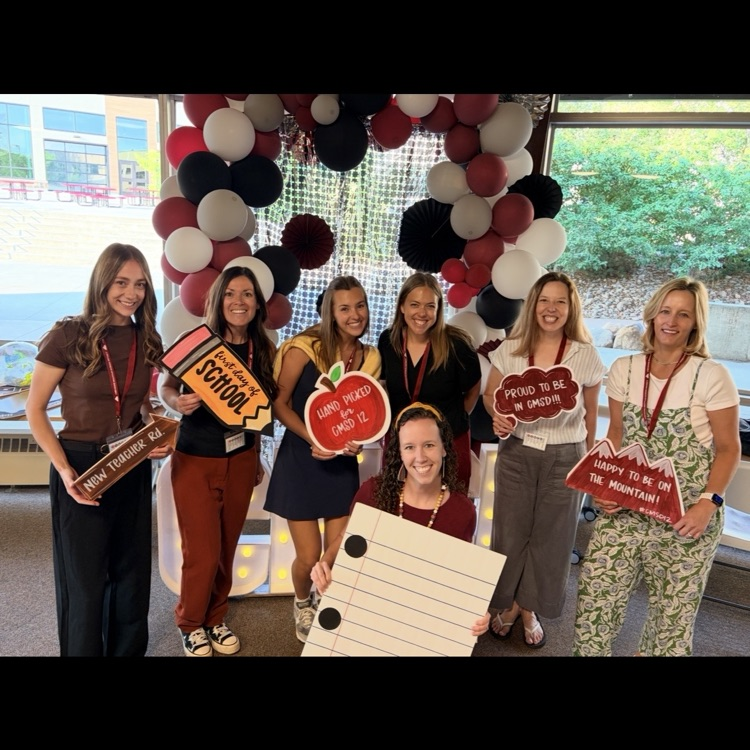 6 new female teachers standing in front of backdrop