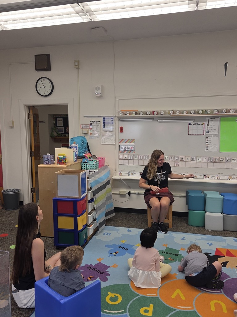 preschool classroom with students and teacher