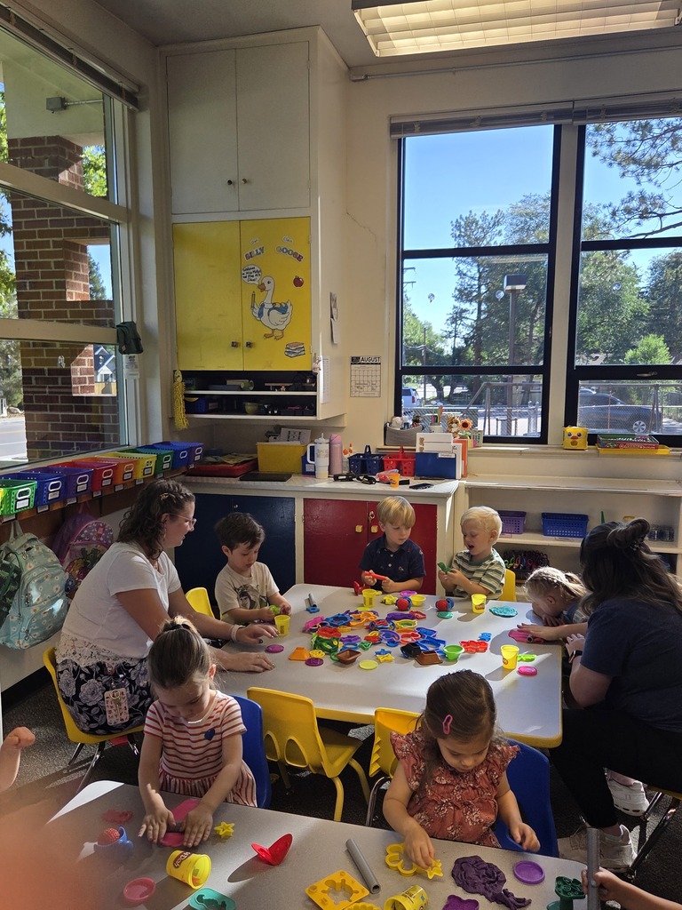 preschool classroom with students and teacher