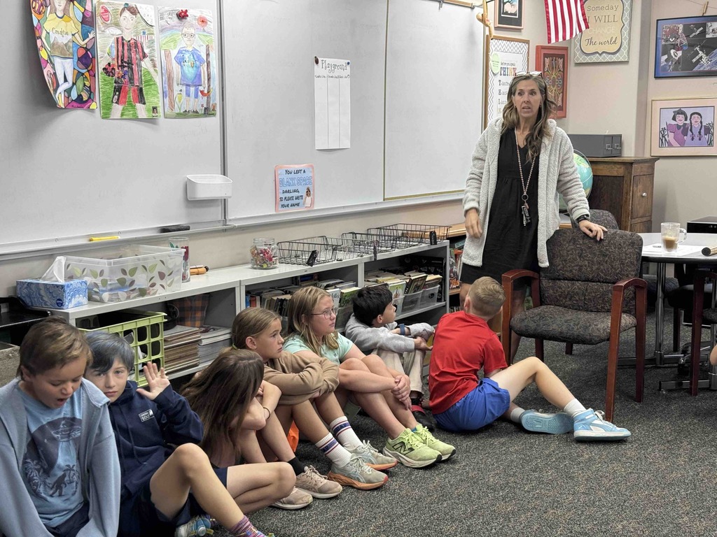 Mrs. Gorab's class discussing what it looks like, sounds like, and feels like on the playground when you feel safe and included.
