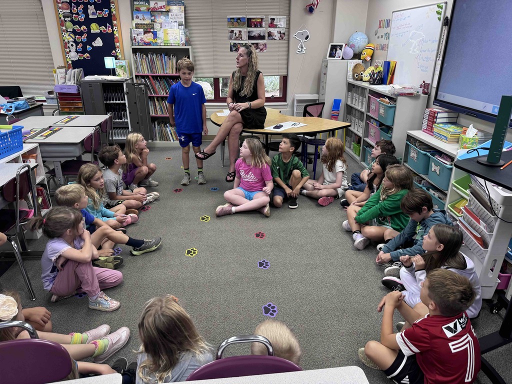 Mrs. Gross class greets each other during Morning Meeting.