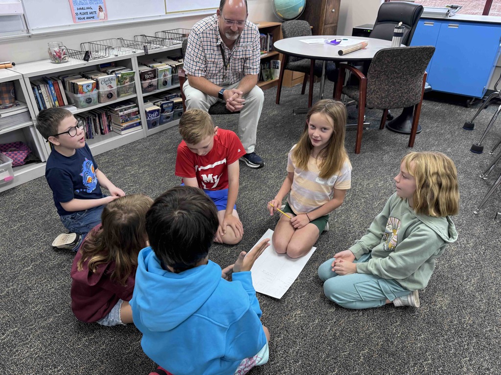 Mrs. Gorab's class discussing what it looks like, sounds like, and feels like on the playground when you feel safe and included.