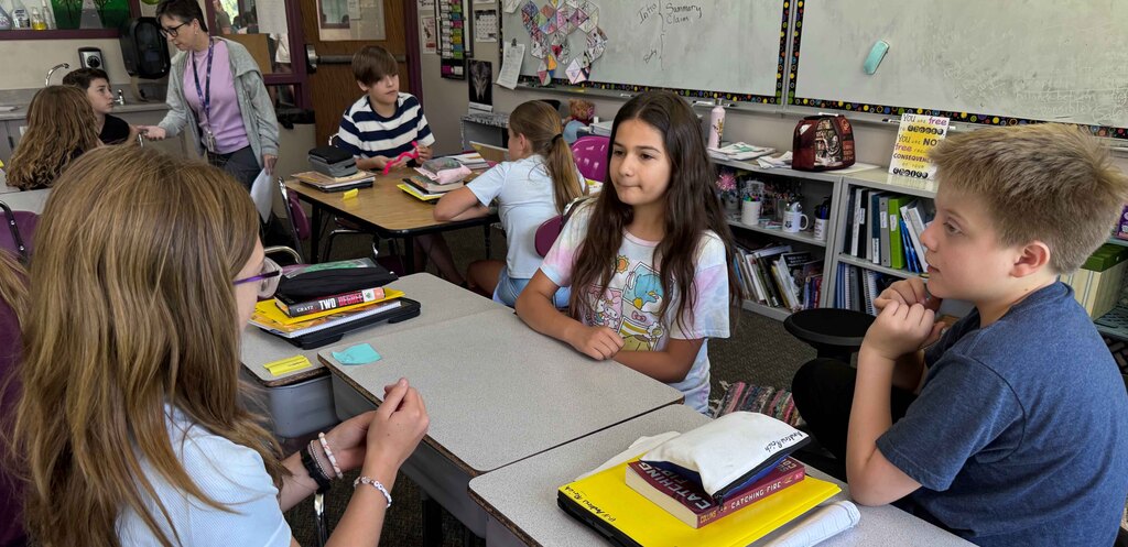 Mrs. Norton's students discussing in small groups the discussion question.