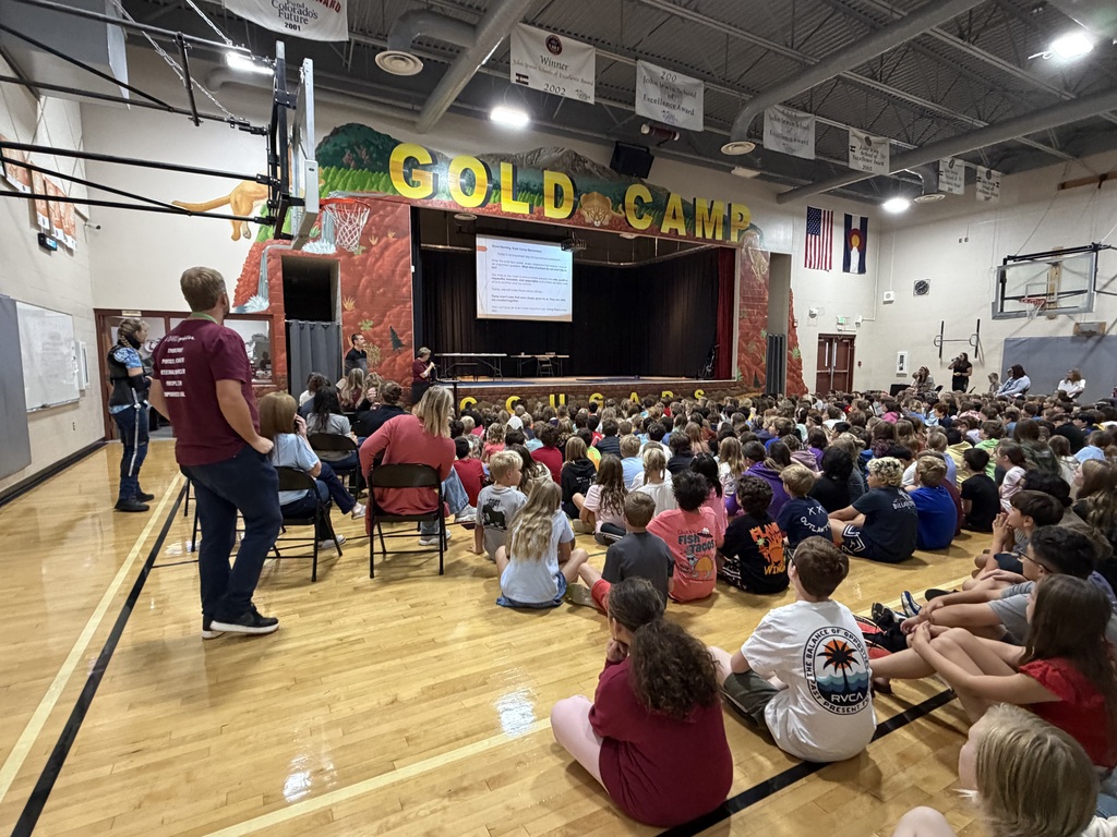 Our first Gold Camp School Assembly brings students and staff together to celebrate their collaborative work in establishing shared expectations, formally introducing and ratifying the four schoolwide rules, and exploring what those rules look and sound like across different common areas of the school.