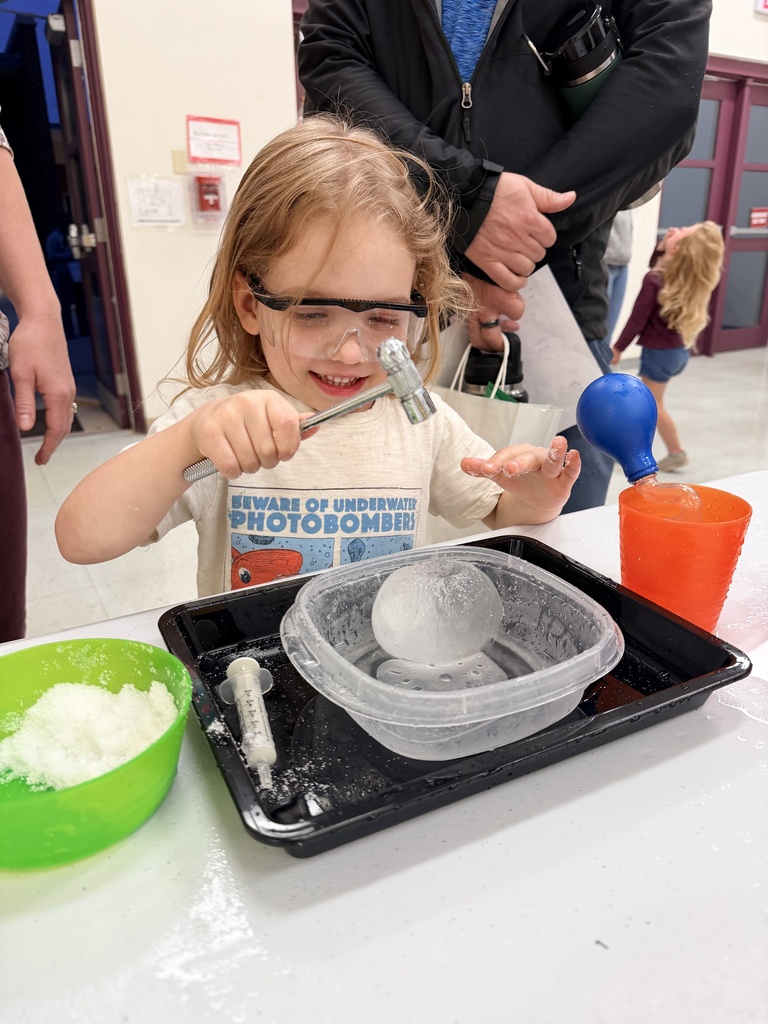 Preschoolers having fun breaking open Dino eggs.