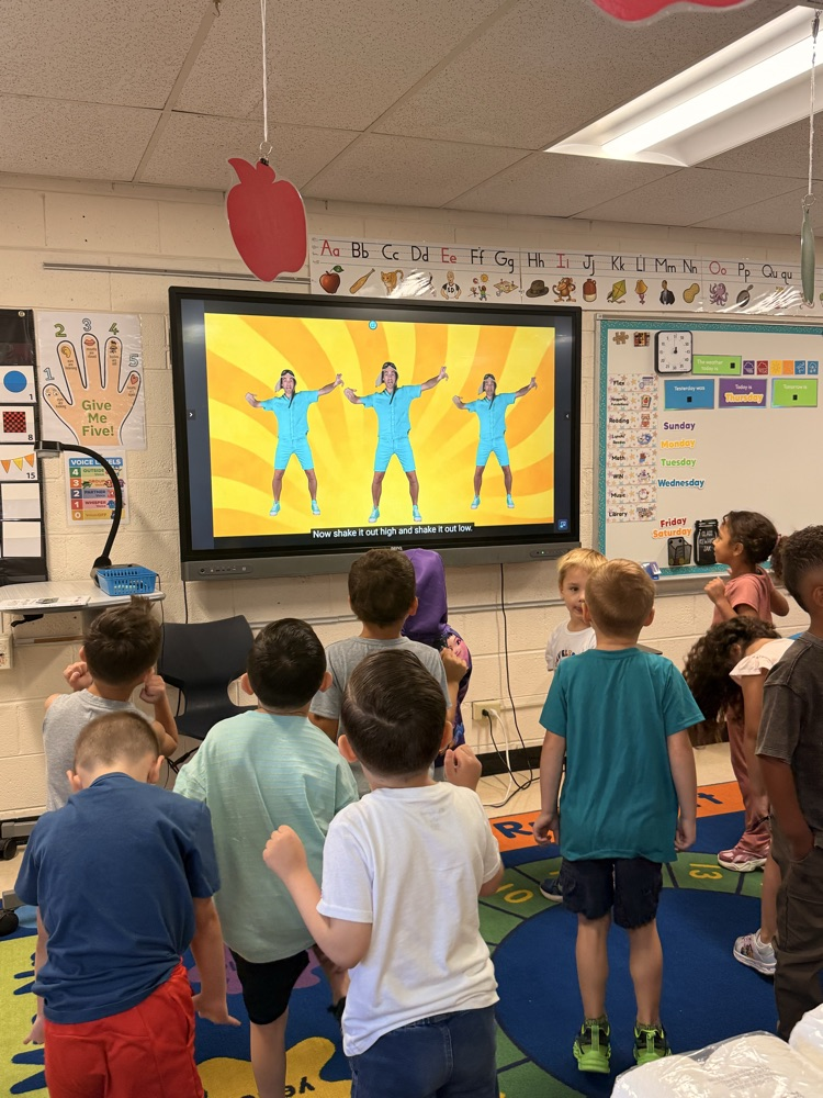 Kindergarten moving their bodies 