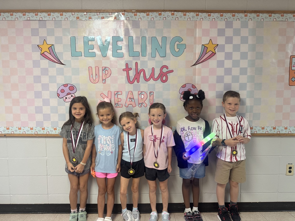 Students Smiling with Medals