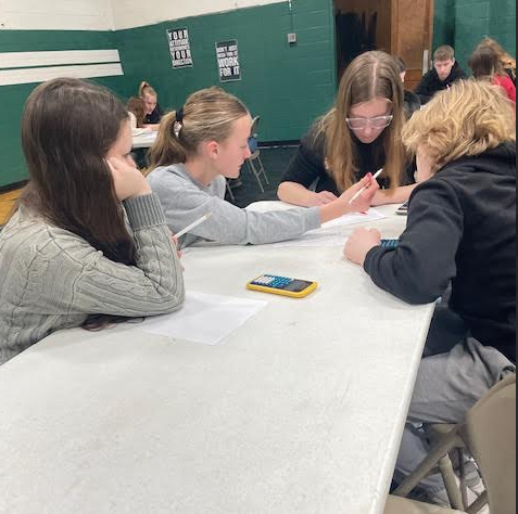 9th Graders working on the Algebra 1 team test