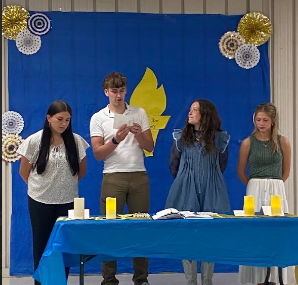 Secretary, Holden Dean, reading the charge of Leadership