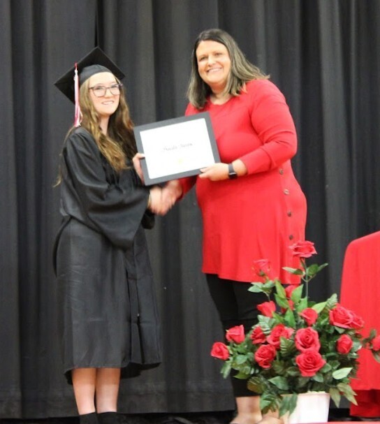 Mrs. Rehn presenting Freida Jones with the Principal's Award