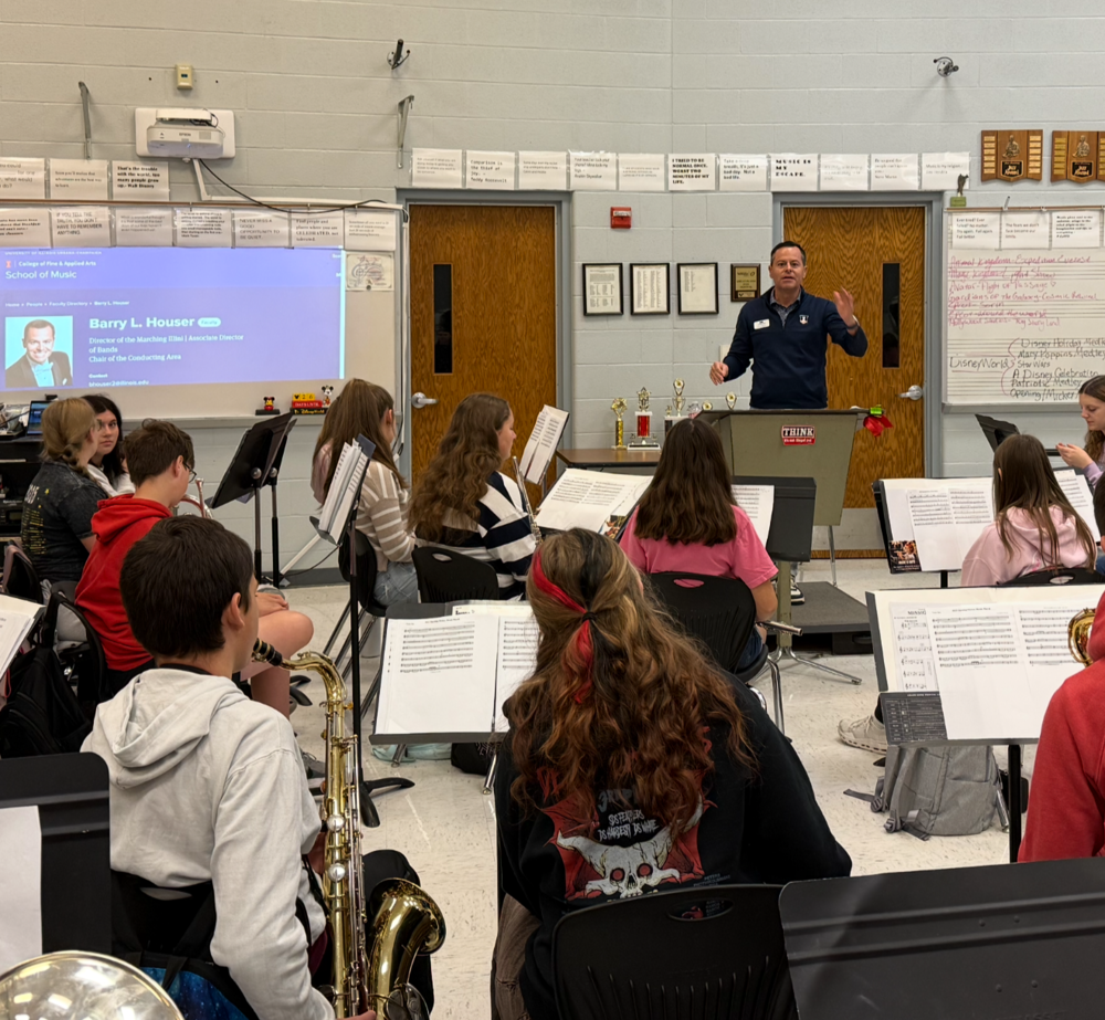 CHS Band practicing with Dr. Barry Houser, the Director of the Marching Illini and Associate Director of Bands at the University of Illinois Urbana-Champaign.