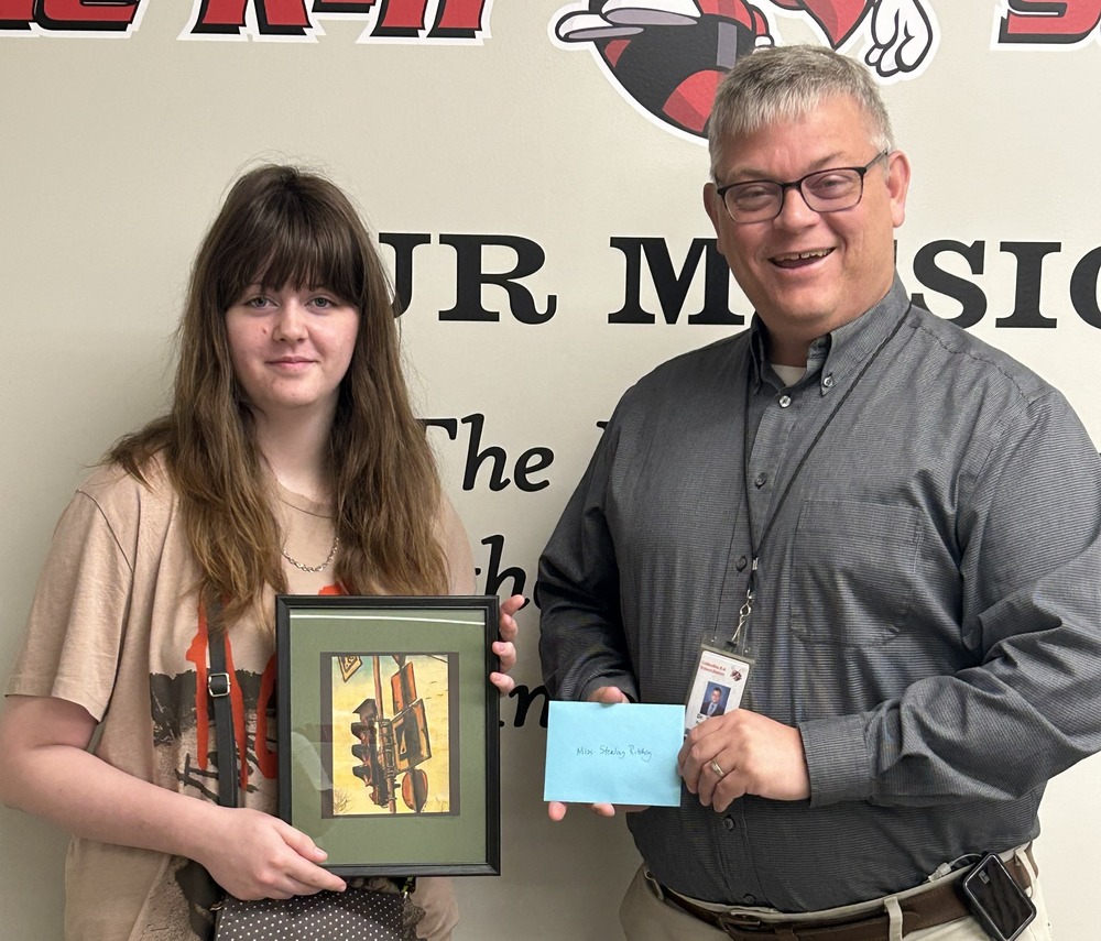 Sterling Richey and Dr. Dan Wiebers with the artwork “Streets” by Sterling Richey, CHS Senior