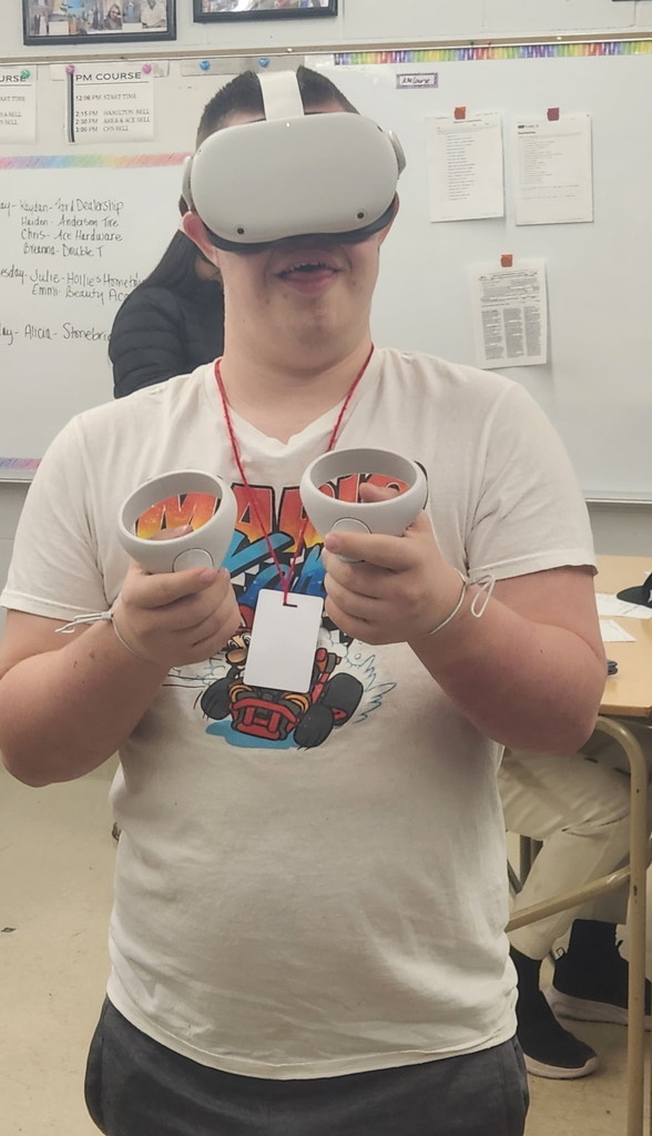 A student in Mrs. Roberts' Career and Independence class using a VR headset.