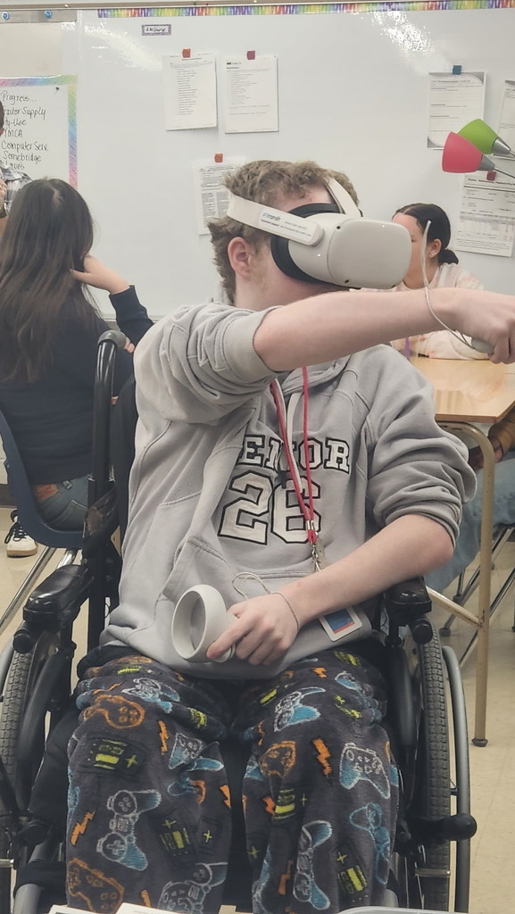 A student in Mrs. Roberts' Career and Independence class using a VR headset.