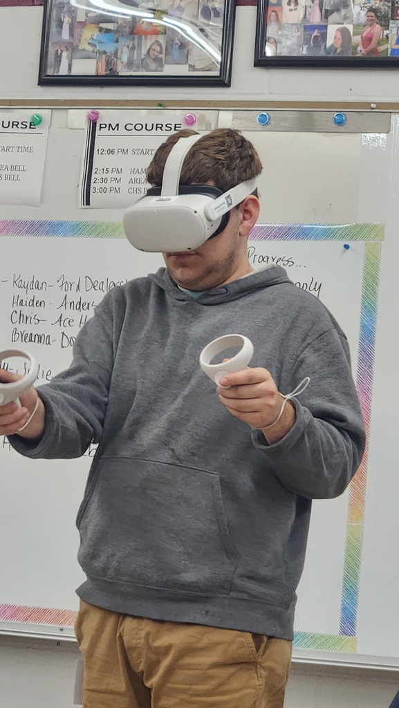 A student in Mrs. Roberts' Career and Independence class using a VR headset.