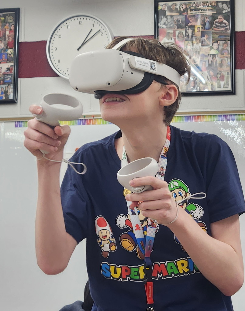 A student in Mrs. Roberts' Career and Independence class using a VR headset.