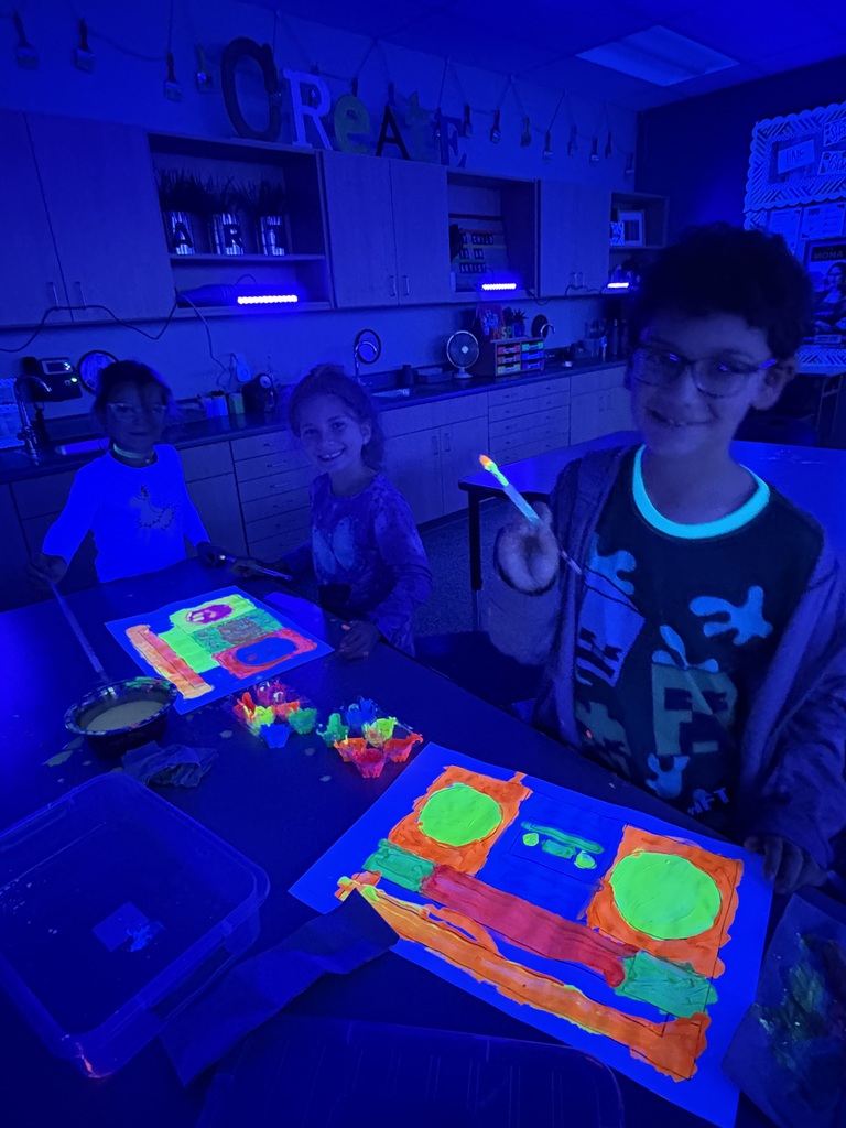 CES art students with glow art.
