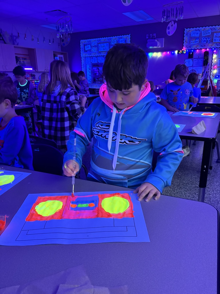 CES art students with glow art.