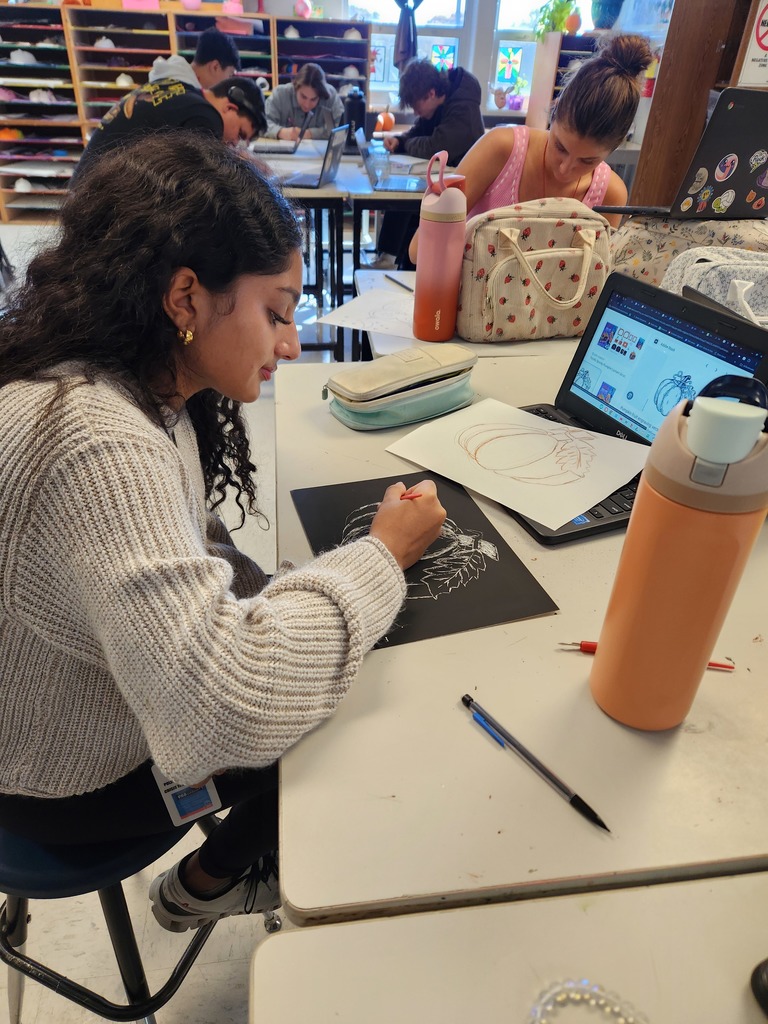 CHS art student creating artwork in class.