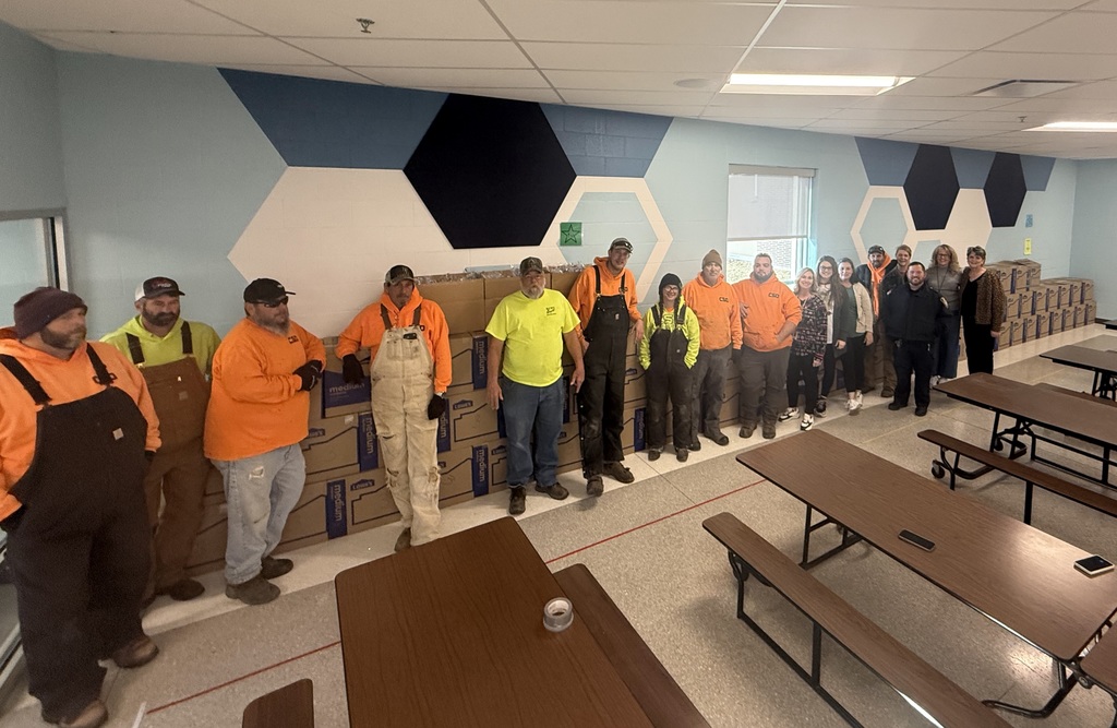 Group photo of City Hall workers who helped organize the food boxes for CES students to take home over Christmas break.