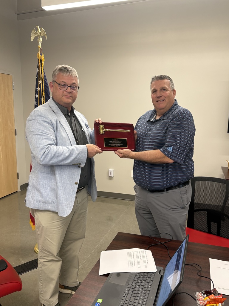 Brice Walker receives a Plaque of Appreciation for his years of service to the Board and for his tenure as Board president.
