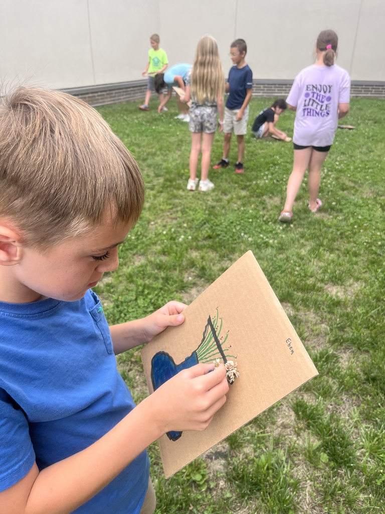 Children making vases as an art project during Summer School today.