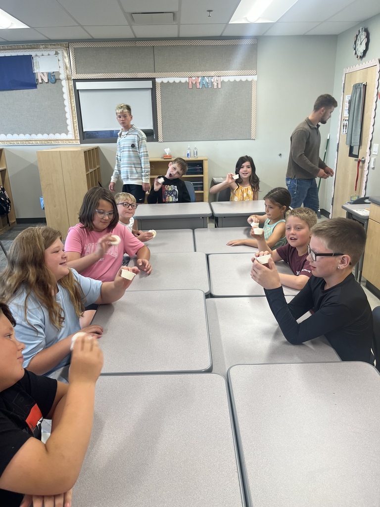 CES Summer School kids making butter
