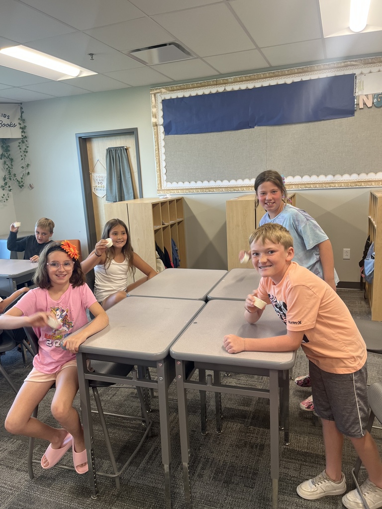CES Summer School kids making butter