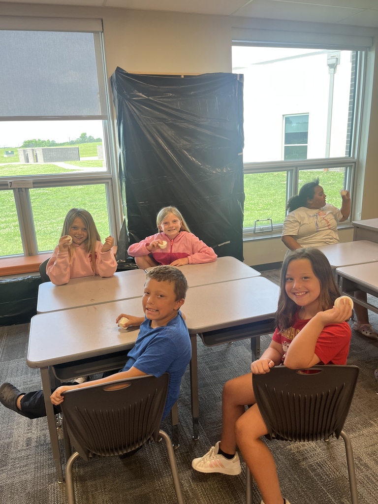 CES Summer School kids making butter.