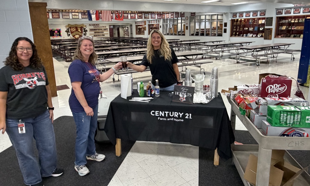 Kristy Lauhoff, of Century 21, handding out dirty sodas to staff during a staff work day at the high school