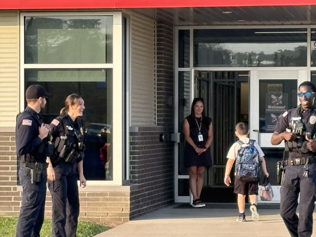 CES students walking into CES and being greeted by the CPD this morning.