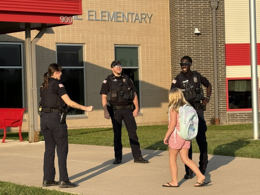 CES students walking into CES and being greeted by the CPD this morning.