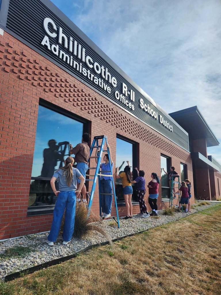 CHS Art Students starting to work on painting the windows of the Chillicothe R-II School District's Administrative Offices this (Tuesday) morning.