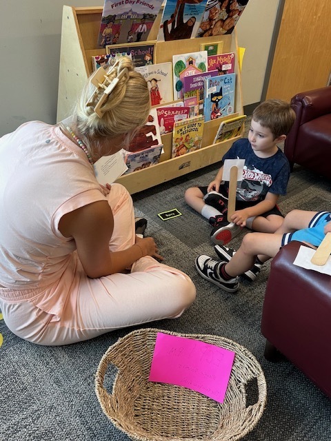 ECP Student reading to CELC Students.